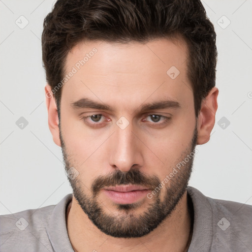 Neutral white young-adult male with short  brown hair and brown eyes