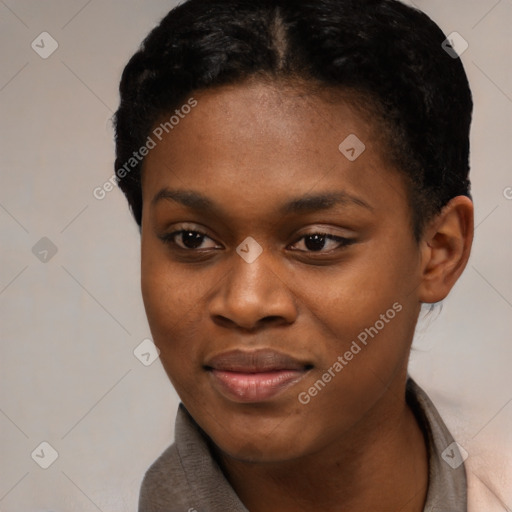 Joyful black young-adult female with short  black hair and brown eyes