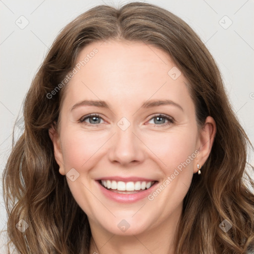 Joyful white young-adult female with long  brown hair and green eyes