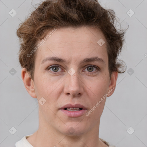 Joyful white adult female with short  brown hair and grey eyes