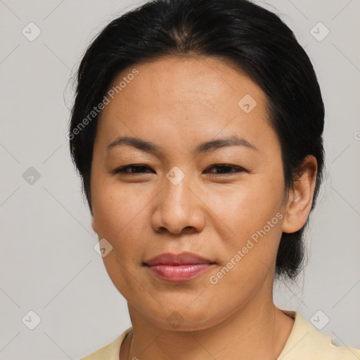 Joyful asian adult female with medium  brown hair and brown eyes