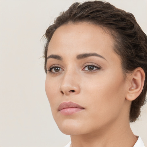 Neutral white young-adult female with medium  brown hair and brown eyes