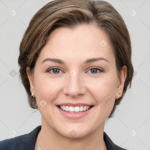 Joyful white young-adult female with medium  brown hair and grey eyes