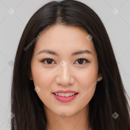 Joyful asian young-adult female with long  brown hair and brown eyes