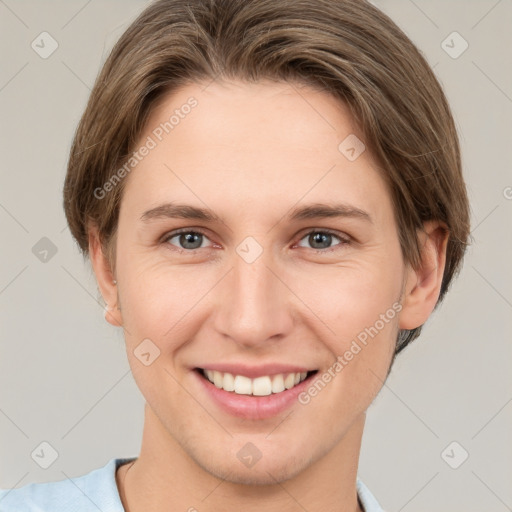 Joyful white young-adult female with short  brown hair and grey eyes