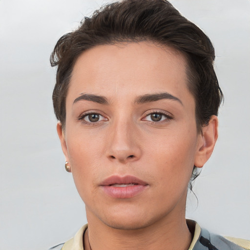 Neutral white young-adult female with short  brown hair and brown eyes