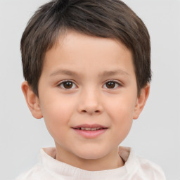 Joyful white child male with short  brown hair and brown eyes