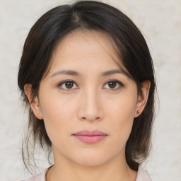 Neutral asian young-adult female with medium  brown hair and brown eyes