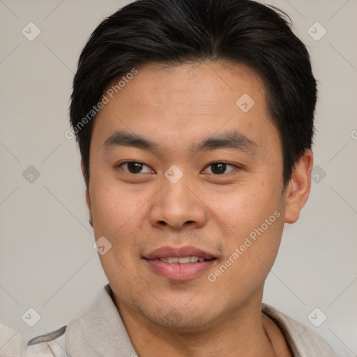 Joyful asian young-adult male with short  brown hair and brown eyes