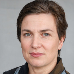 Joyful white adult male with short  brown hair and grey eyes