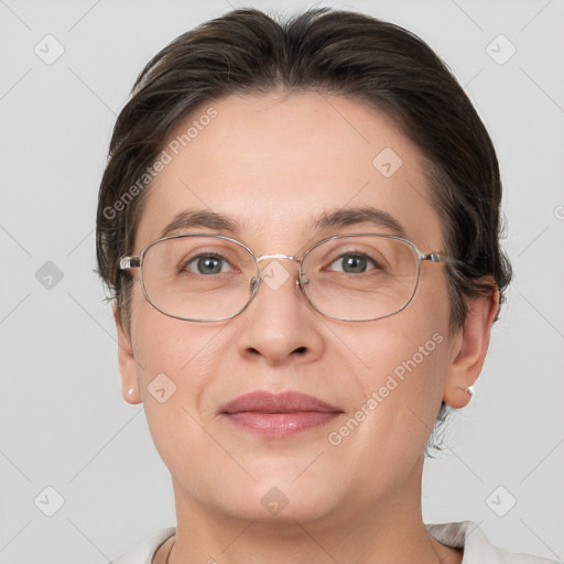 Joyful white adult female with short  brown hair and brown eyes