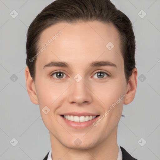 Joyful white young-adult female with short  brown hair and grey eyes