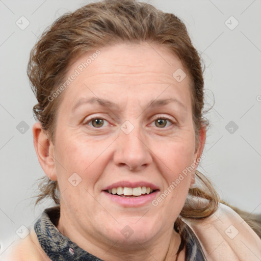 Joyful white adult female with medium  brown hair and blue eyes