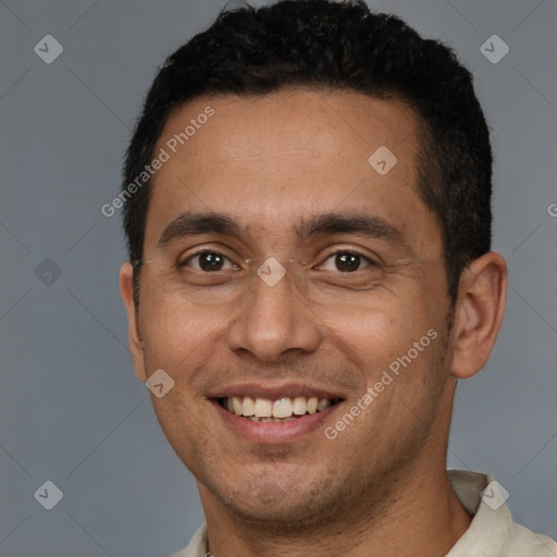 Joyful white young-adult male with short  brown hair and brown eyes