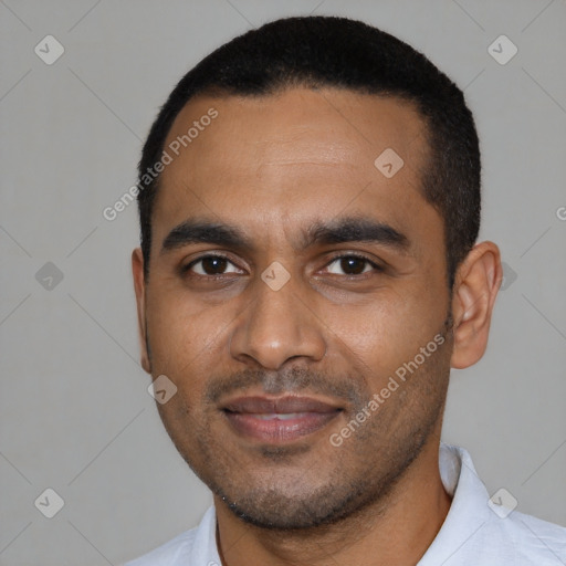 Joyful black young-adult male with short  black hair and brown eyes