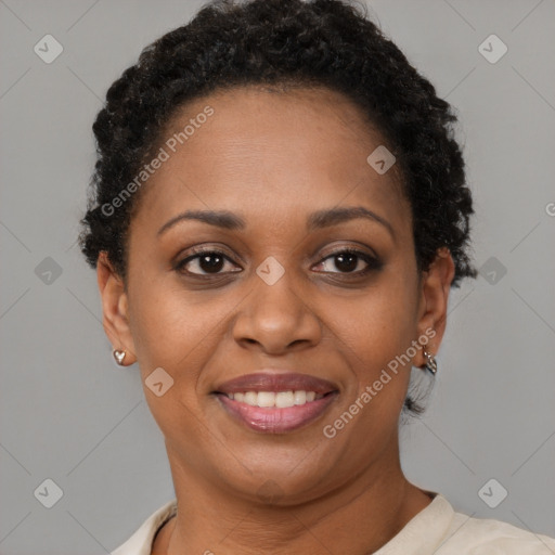 Joyful black adult female with short  brown hair and brown eyes