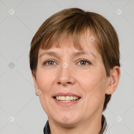 Joyful white adult female with short  brown hair and grey eyes