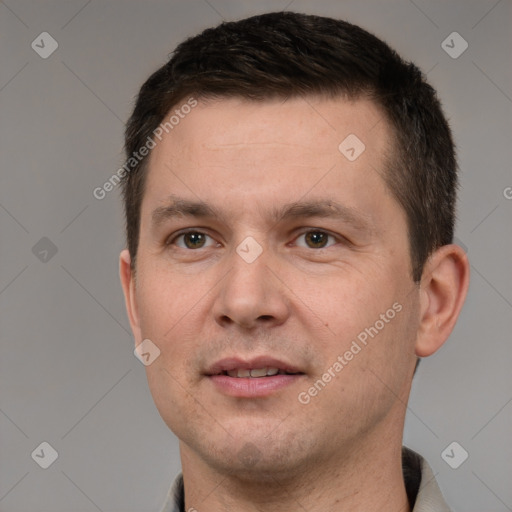 Joyful white young-adult male with short  brown hair and grey eyes