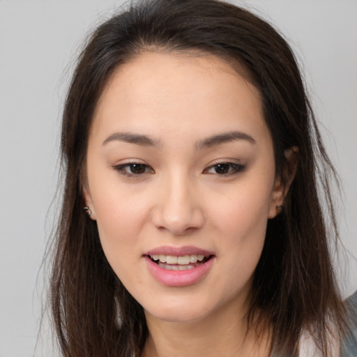 Joyful white young-adult female with long  brown hair and brown eyes