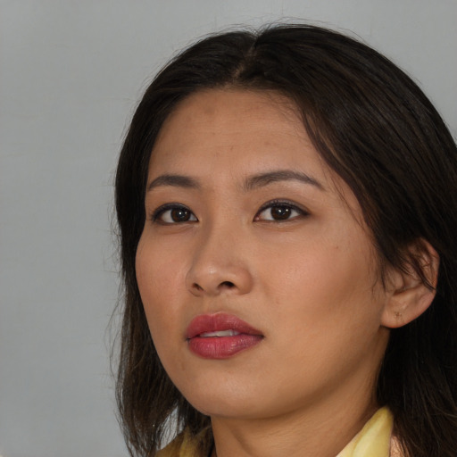 Neutral asian young-adult female with long  brown hair and brown eyes