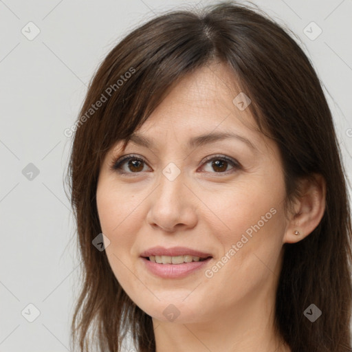 Joyful white adult female with long  brown hair and brown eyes