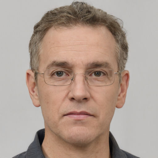 Neutral white middle-aged male with short  brown hair and grey eyes