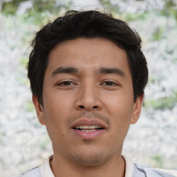 Joyful asian young-adult male with short  black hair and brown eyes