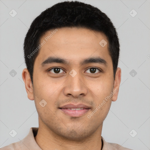 Joyful latino young-adult male with short  brown hair and brown eyes