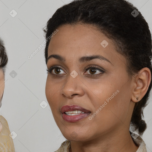 Joyful black young-adult female with short  brown hair and brown eyes