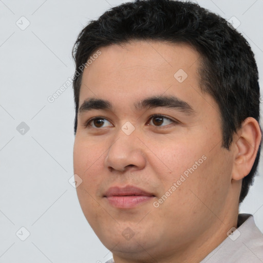 Joyful white young-adult male with short  black hair and brown eyes