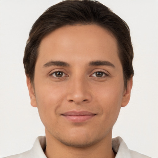 Joyful white young-adult male with short  brown hair and brown eyes