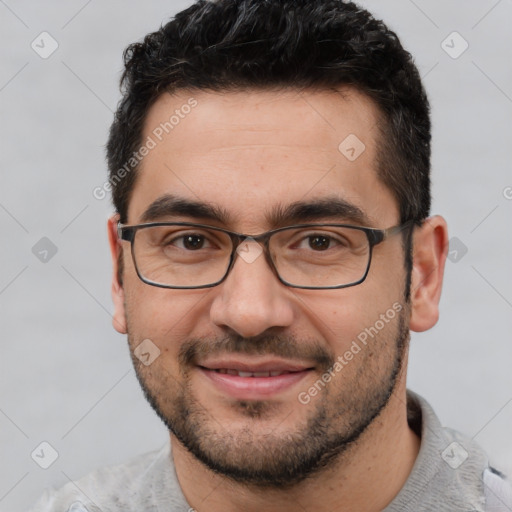 Joyful white young-adult male with short  black hair and brown eyes