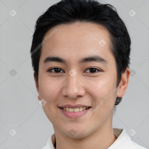 Joyful asian young-adult male with short  brown hair and brown eyes