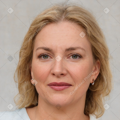 Joyful white adult female with medium  brown hair and grey eyes