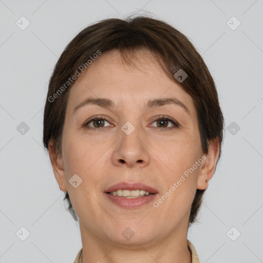 Joyful white adult female with short  brown hair and brown eyes