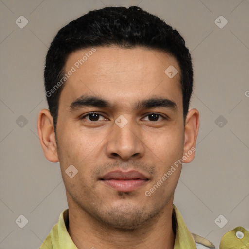 Joyful latino young-adult male with short  black hair and brown eyes