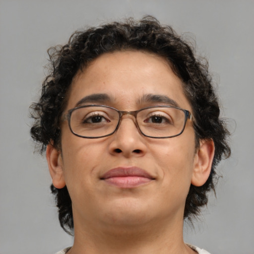 Joyful latino adult female with short  brown hair and brown eyes