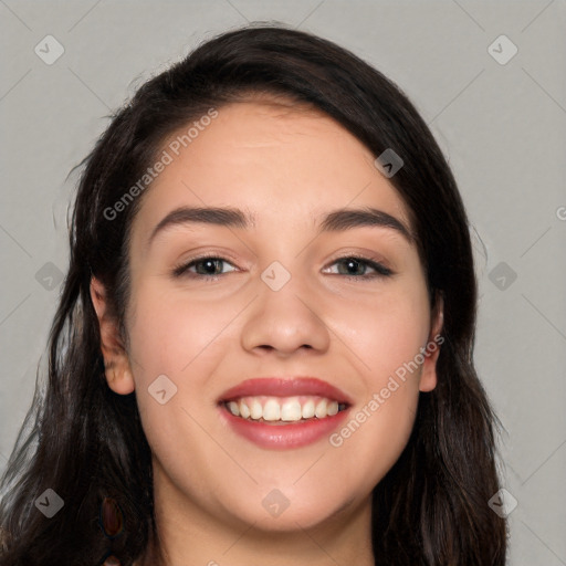 Joyful white young-adult female with long  black hair and brown eyes