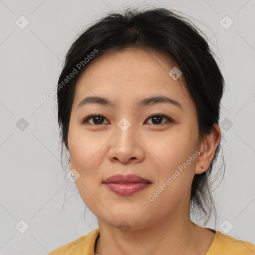 Joyful asian young-adult female with medium  brown hair and brown eyes