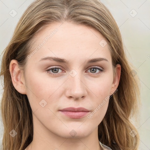 Joyful white young-adult female with long  brown hair and blue eyes