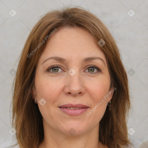 Joyful white adult female with medium  brown hair and grey eyes