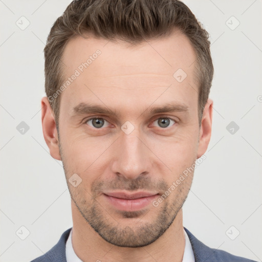 Joyful white young-adult male with short  brown hair and grey eyes