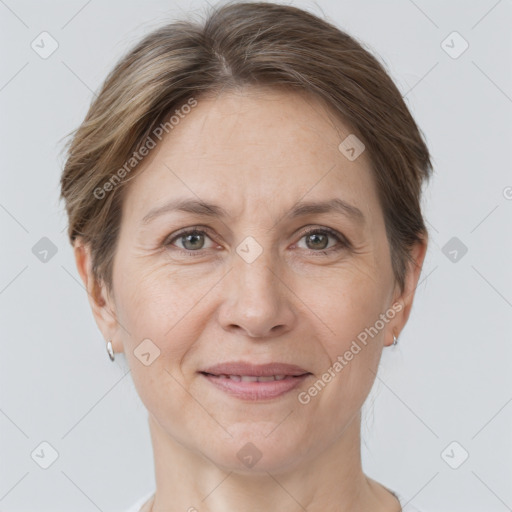 Joyful white adult female with short  brown hair and grey eyes