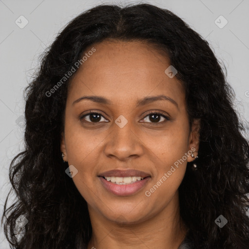 Joyful black young-adult female with long  brown hair and brown eyes