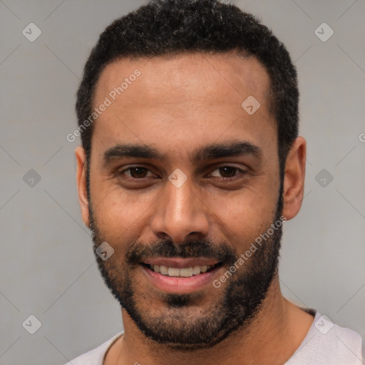 Joyful white young-adult male with short  black hair and brown eyes