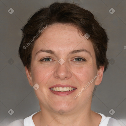 Joyful white adult female with short  brown hair and grey eyes