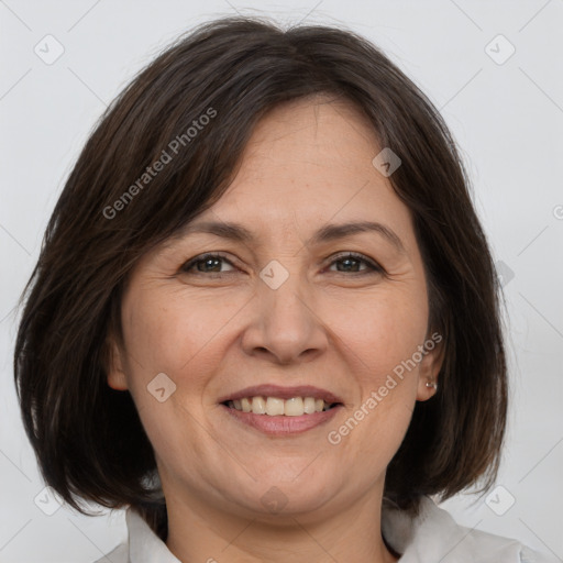 Joyful white adult female with medium  brown hair and brown eyes