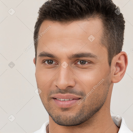 Joyful white young-adult male with short  brown hair and brown eyes