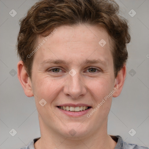 Joyful white adult male with short  brown hair and grey eyes