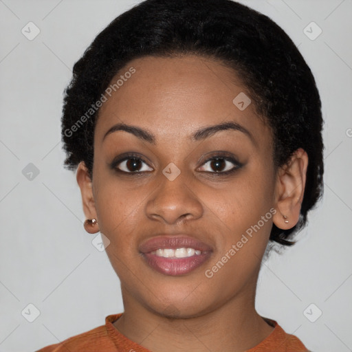 Joyful black young-adult female with short  brown hair and brown eyes